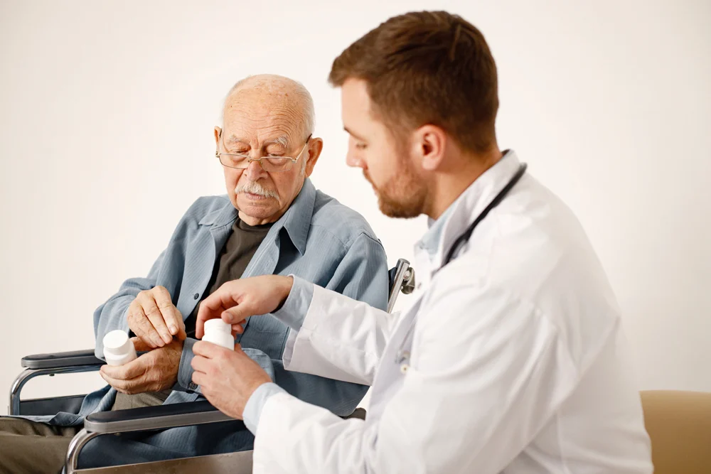 male doctor old man wheelchair isolated white background